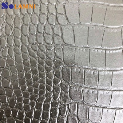 Pelle sintetica in PVC con motivo coccodrillo lucido